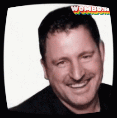 Man Smiling at Screen Saying Wombo N