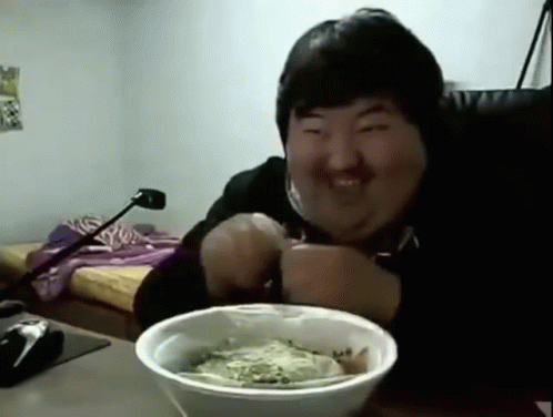 Man Smiling At Table With Bowl Of Food GIF