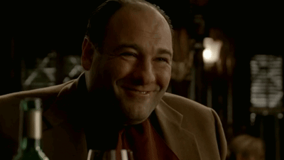 Man Smiling At Wine Bottle GIF