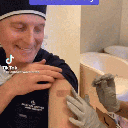 Man Smiling Getting Vaccine at Boxer Wache Vision Institute