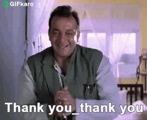 Man Smiling Giving Thank You Gesture GIF