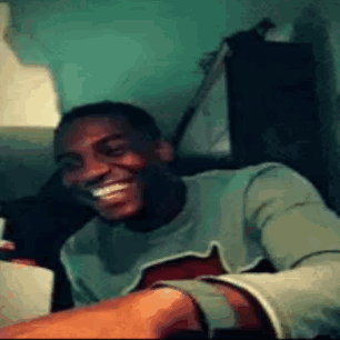 Man Smiling Holding Guitar