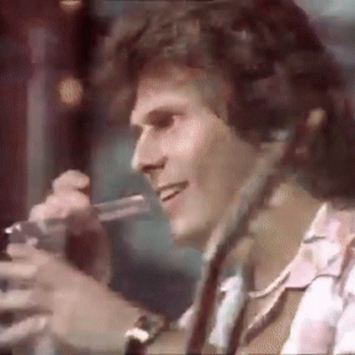Man Smiling Holding Microphone With Headphones GIF