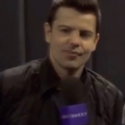 Man Smiling Holding Yahoo Microphone