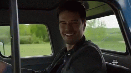 Man Smiling In Back Seat Of Car GIF