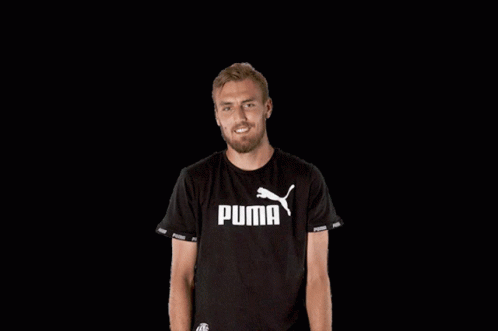 Man Smiling in Black Puma T-Shirt