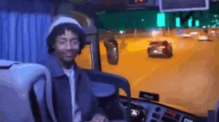 Man Smiling in Bus Driver's Seat