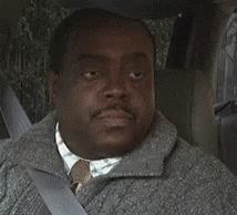 Man Smiling in Car Back Seat