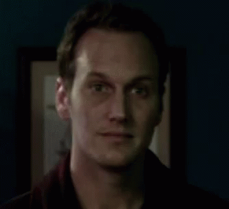 Man Smiling In Dark Room GIF