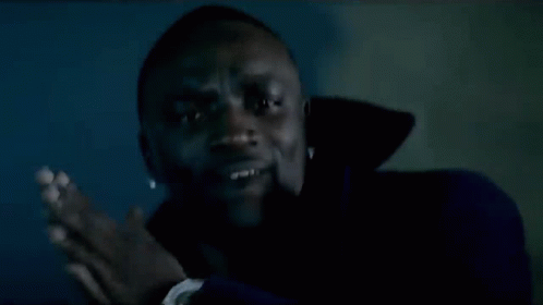 Man Smiling In Dark Room GIF