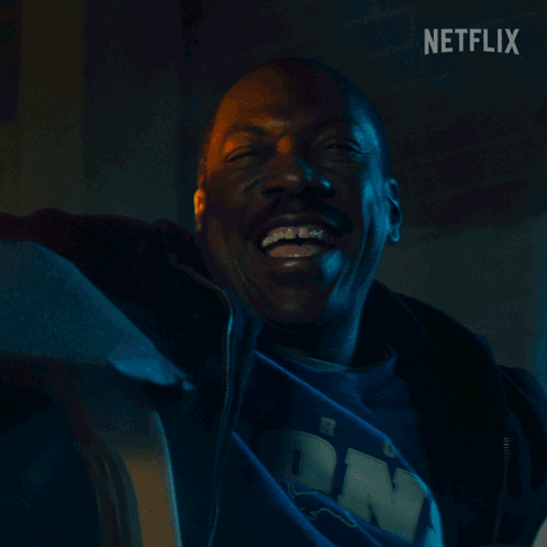 Man Smiling In Front Of Brick Wall Netflix GIF