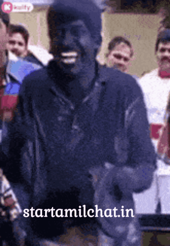 Man Smiling In Front Of Crowd GIF