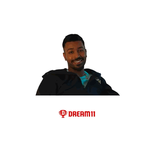 Man Smiling in Front of Dream Big Logo