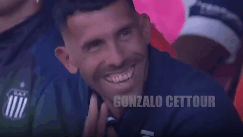 Man Smiling in Front of Punto Inteligente Sign