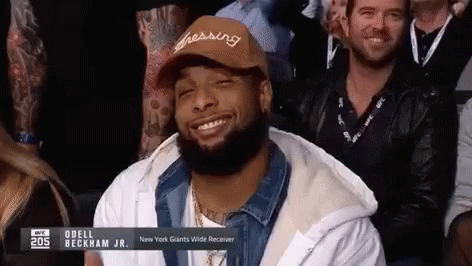 Man Smiling in Hat Saying Dressing