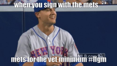 Man Smiling in Mets Jersey