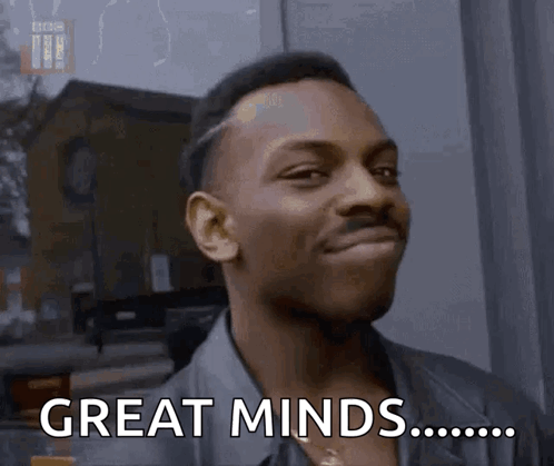 Man Smiling Saying Great Minds GIF