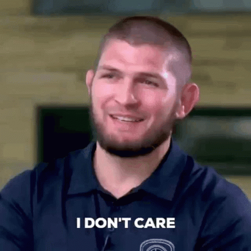 Man Smiling Saying I Don't Care GIF