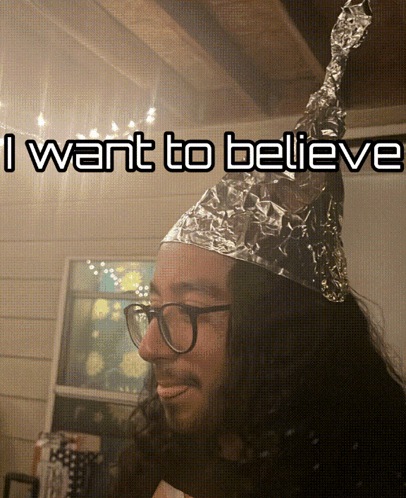 Man Smiling Wearing Tin Hat GIF