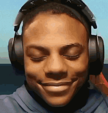 Man Smiling With Headphones GIF