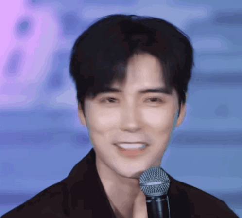 Man Smiling with Shure Microphone