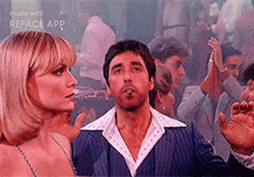 Man Smoking Cigar While Woman Watches