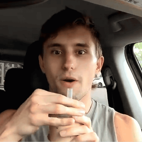 Man Smoking Cigarette In Car GIF