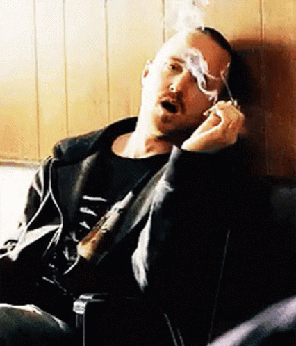 Man Smoking Cigarette In Chair GIF