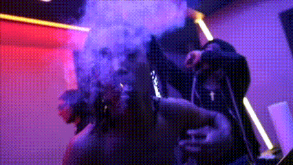 Man Smoking Cigarette In Dark Room With Smoke GIF