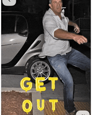 Man Smoking Cigarette In Front Of Car Saying Get Out GIF