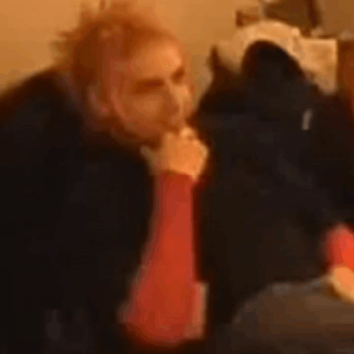 Man Smoking Cigarette In Front Of Cat GIF