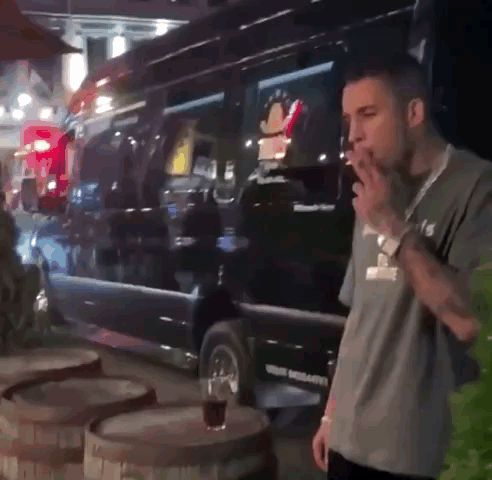 Man Smoking Cigarette In Front Of Texas Van GIF