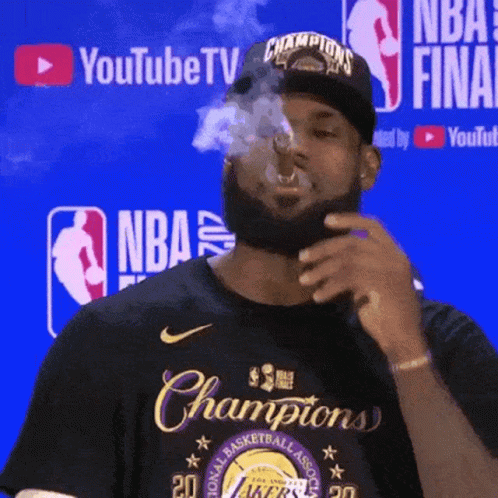 Man Smoking Cigarette in Front of YouTube TV Sign
