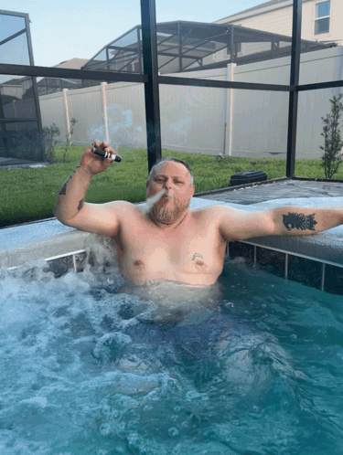 Man Smoking Cigarette in Hot Tub