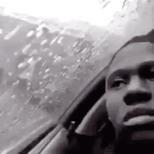 Man Smoking Cigarette Looking Out Car Window