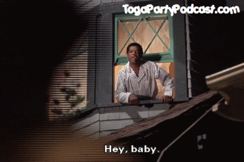 Man Smoking Cigarette Looking Out Window Saying Hey Baby