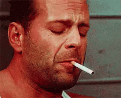 Man Smoking Cigarette With Eyes Closed GIF