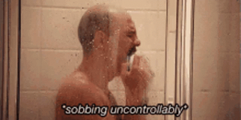 Man Sobbing Uncontrollably in Shower