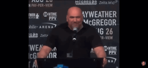 Man Speaking Into Microphone