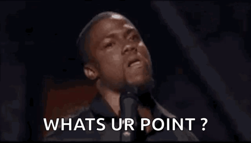 Man Speaking Into Microphone Asking What's Ur Point