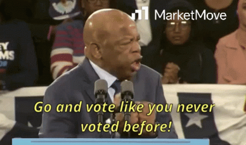 Man Speaking Into Microphone Go and Vote