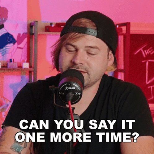 Man Speaking Into Microphone Saying Can You Say It One More Time