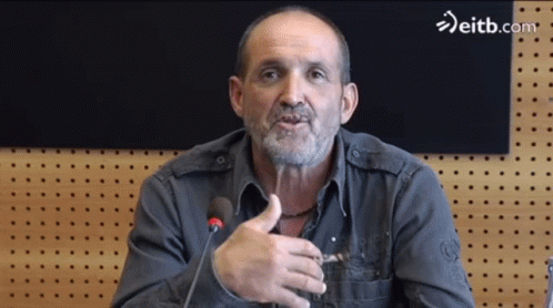 Man Speaking Into Microphone With Eitb.com
