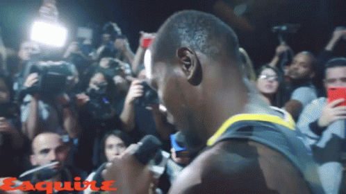 Man Speaking Into Microphone With Esquire