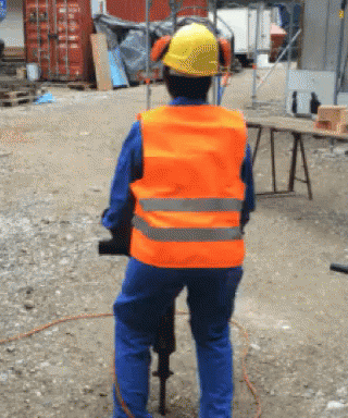 Man Spinning While Holding A Jackhammer GIF