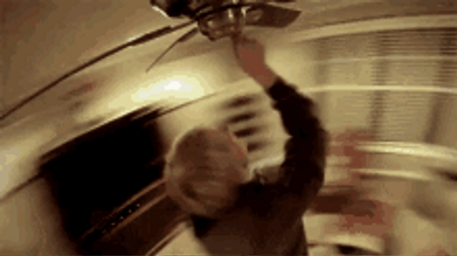 Man Spinning With Ceiling Fan Gif