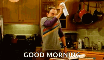 Man Spraying Napkin In Kitchen Saying Good Morning GIF