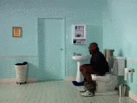 Man Squatting On Toilet In Blue Bathroom GIF
