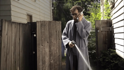 Man Squirt Water Using Fire Hose GIF