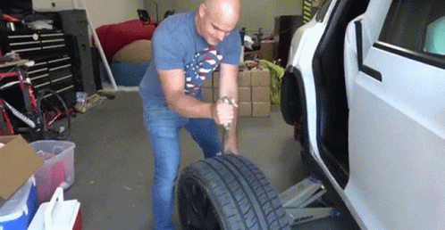 Man Stabbing A Tire GIF